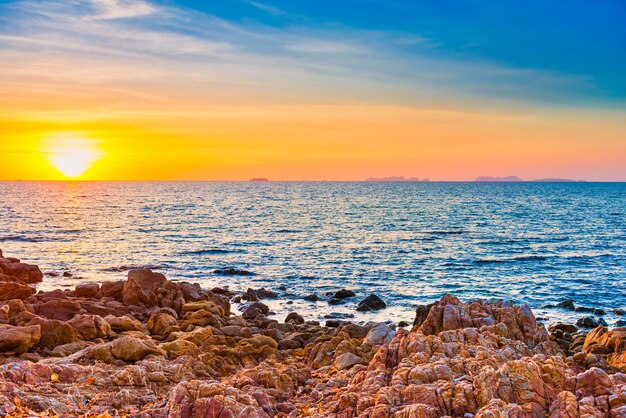 Sunset sea with rocks and evening sunset