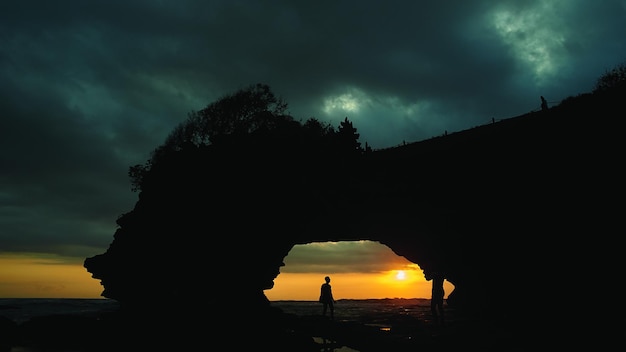 Sunset and silhouette view at Batu Bolong Temple in Bali Indonesia