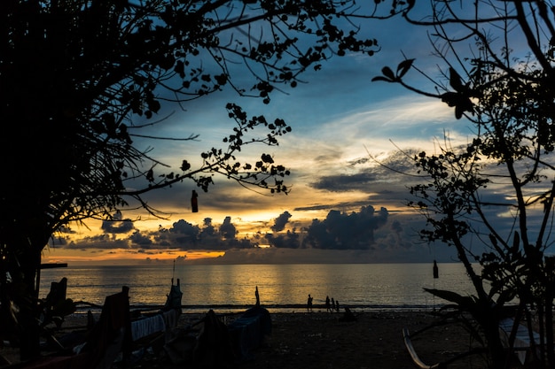 Sunset sky over the indian ocean. Cloudy sunset in the tropics.