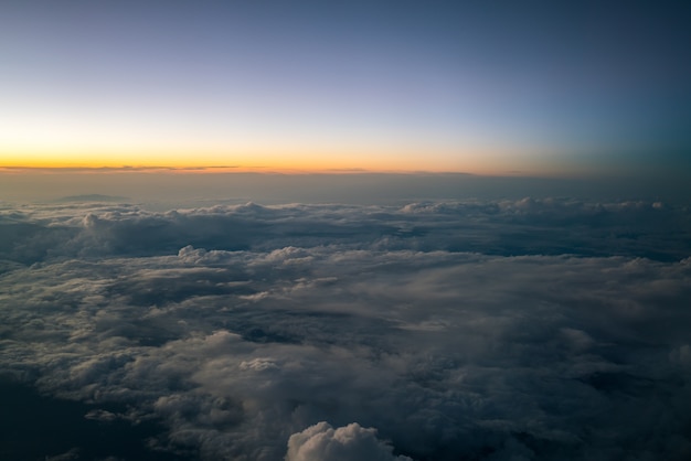 Sunset sky viewed from airplane window.