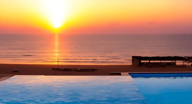 Photo sunset above a swimming pool atlantic ocean and a beach