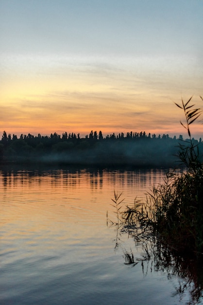 Sunset time and fog under the lake