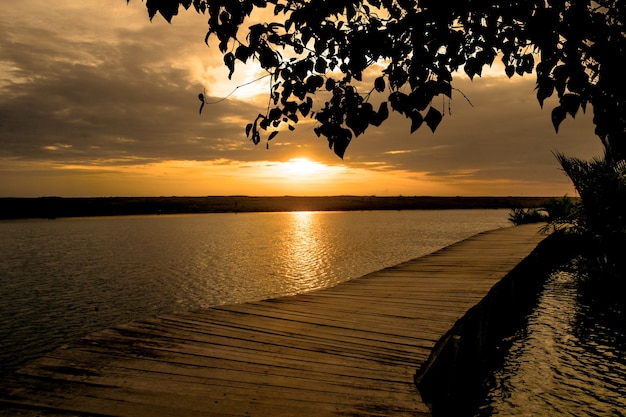 Sunset time at lake with wooden dock