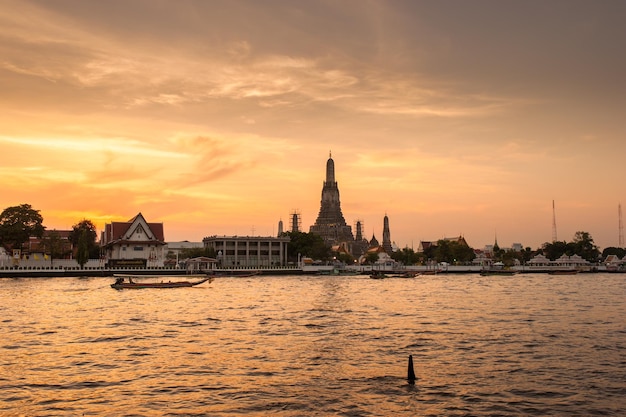 Sunset time view of Wat Arun Temple across Chao Phraya River in Bangkok Thailand