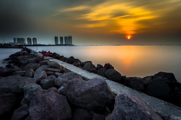 A sunset view of the beach and the ocean