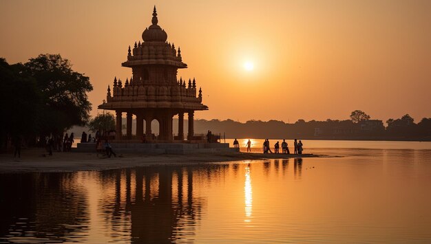 a sunset view of a temple with a sunset in the background