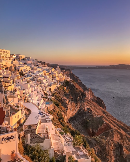 Sunset view of traditional Greek village Oia on Santorini island in Greece.