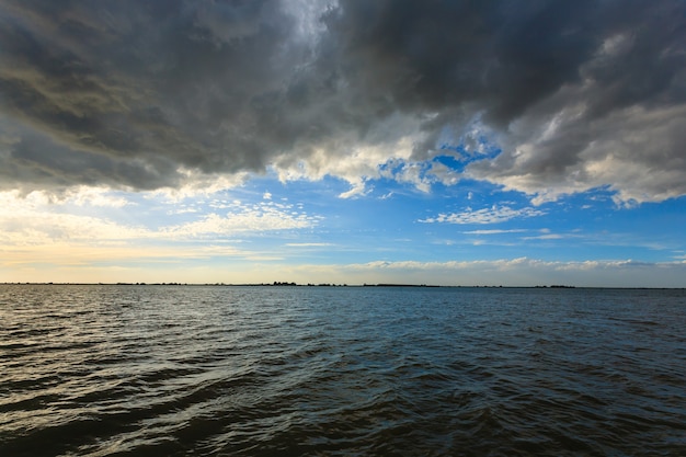 Sunset over water from "Delta del Po" water and sky