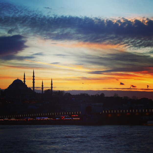 A sunset with a blue mosque in the background istanbul eminonu