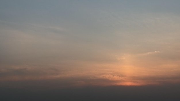 A sunset with a blue sky and clouds