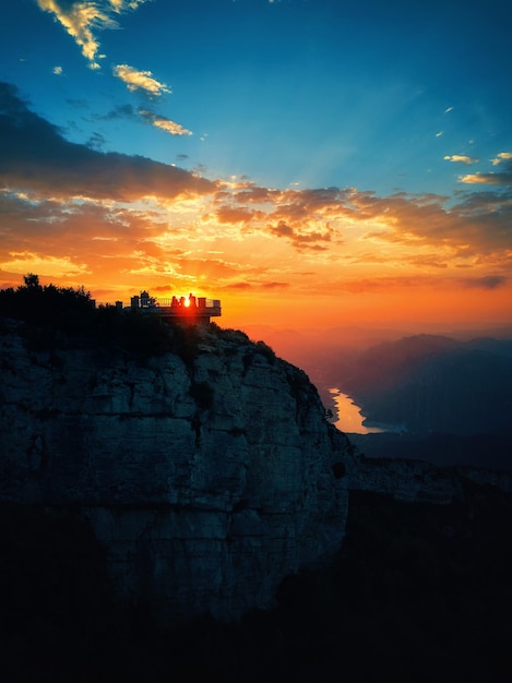 A sunset with a boat on the top of it