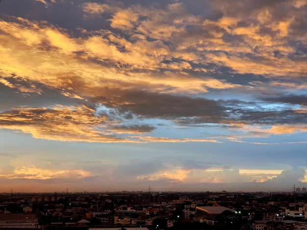 Sunset with clouds in the sky over the city