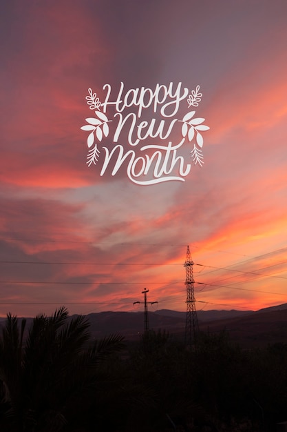 Foto tramonto con scritte di felice anno nuovo