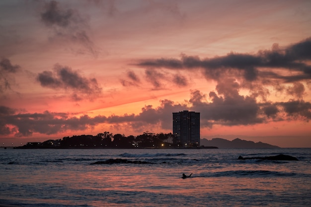 Sunset with red sky on a beach in the city of Vigo, Galicia, Spain 