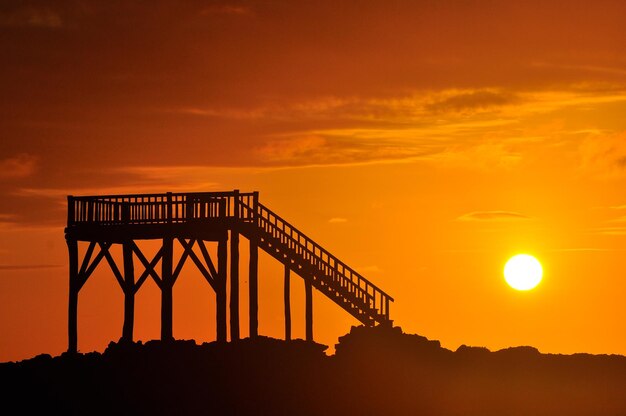 A sunset with steps as a silhouette