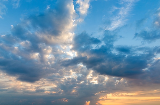 Sunset with sun rays and clouds