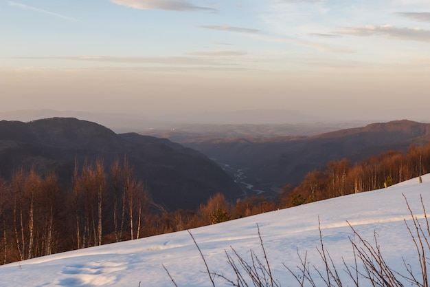 Sunset with a view of the snowcapped mountain peaks of Arkhyz near the BTA