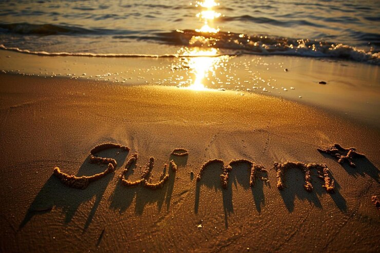 Photo sunshine handwritten in sand on a beach