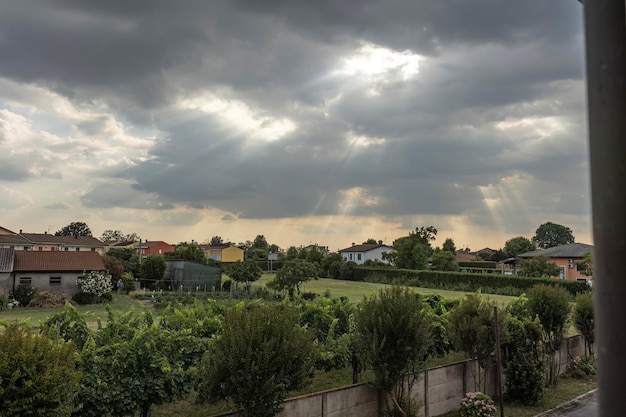 Sunshine Piercing Clouds over Countryside Village