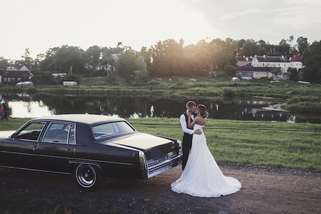 Sunshine portrait of happy bride and groom