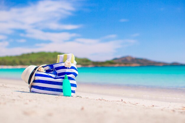 suntan lotion bottles and starfish at the beach