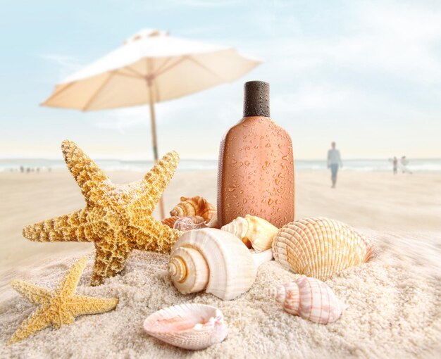 Suntan lotion and seashells on the beach