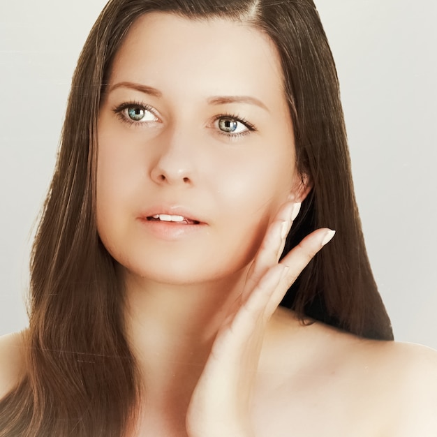 Suntan skin tone and beauty routine beautiful brunette female model with natural tan face portrait of young woman