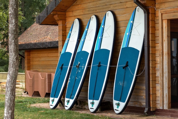 SUP surfboards Rental station for active recreation and water sports inflatable boards