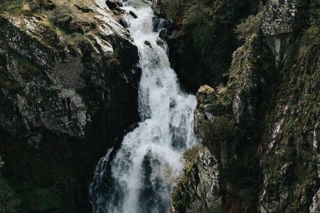 Super close up of a waterfall in the middle of the mountains relax and inspiration concepts with copy space