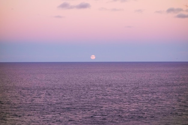 super full moon rises up to sky over the sea