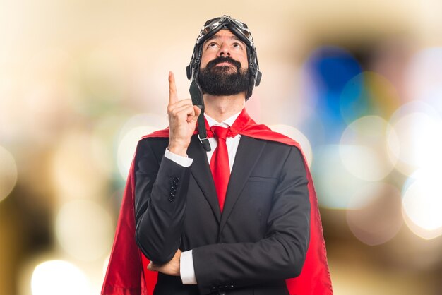 Super hero businessman  on unfocused background