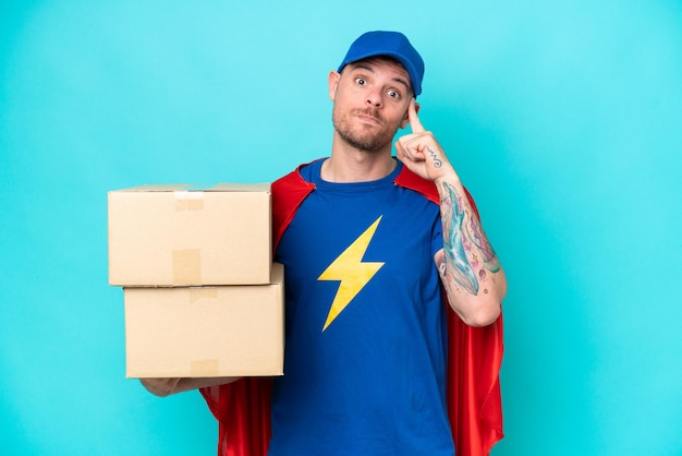 Super Hero delivery man over isolated background thinking an idea