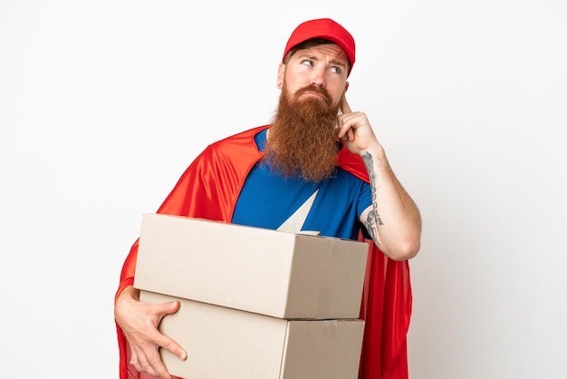 Super Hero delivery reddish man isolated on white background having doubts