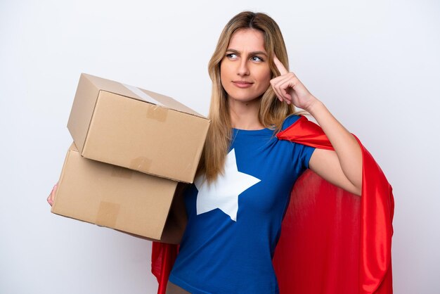 Super Hero delivery woman isolated on white background having doubts and thinking