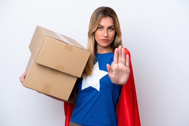 Super Hero delivery woman isolated on white background making stop gesture