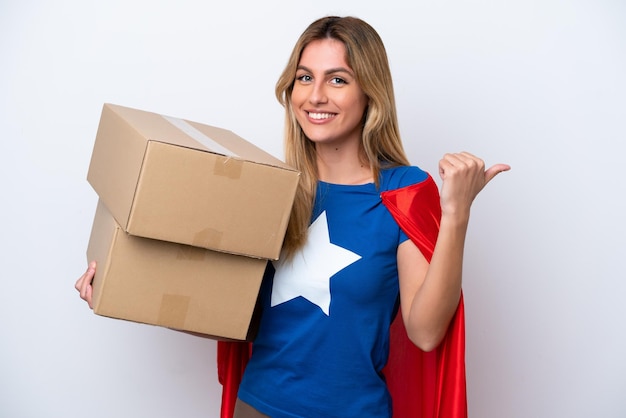 Super Hero delivery woman isolated on white background pointing to the side to present a product