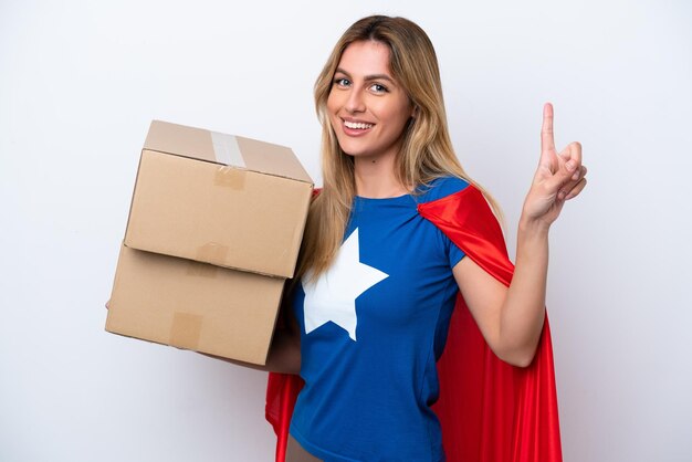 Super Hero delivery woman isolated on white background showing and lifting a finger in sign of the best