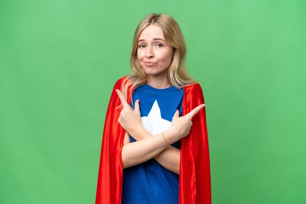 Super Hero English woman over isolated background pointing to the laterals having doubts