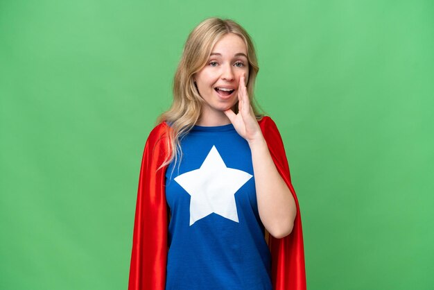 Super Hero English woman over isolated background shouting with mouth wide open