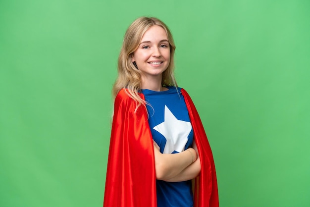 Super Hero English woman over isolated background with arms crossed and looking forward