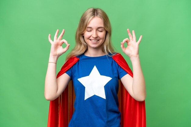 Super Hero English woman over isolated background in zen pose