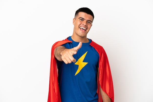Super Hero over isolated white background with thumbs up because something good has happened