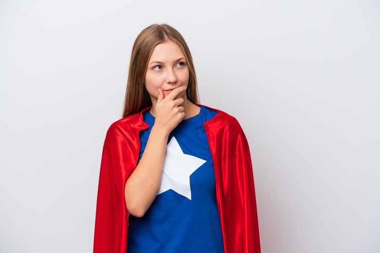 Photo super hero russian woman isolated on white background having doubts and with confuse face expression