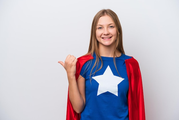 Super Hero Russian woman isolated on white background pointing to the side to present a product