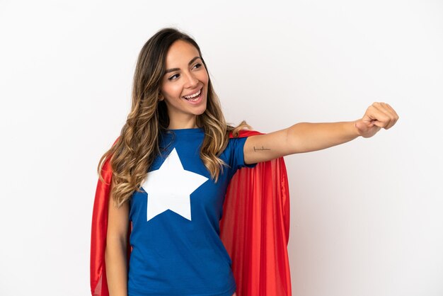 Super Hero woman over isolated white background giving a thumbs up gesture