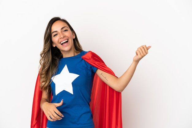 Super Hero woman over isolated white background making guitar gesture