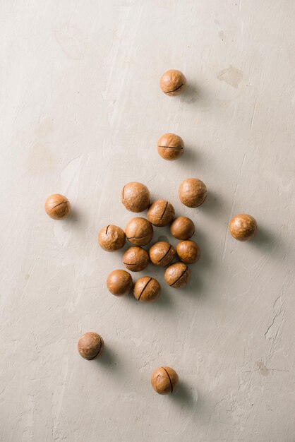 Superfood organic macadamia nut on stone background