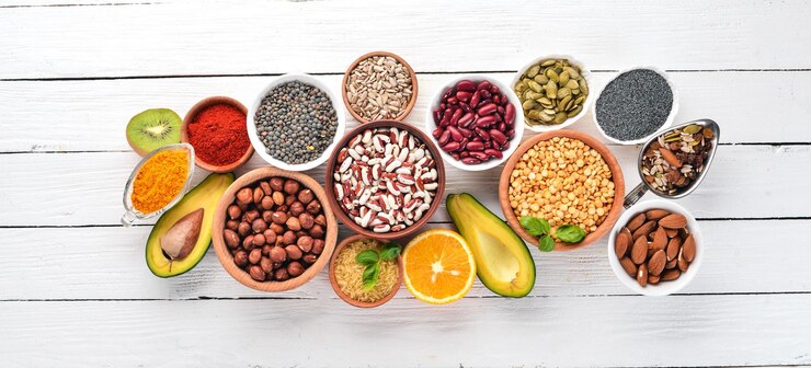 Superfoods Healthy food Nuts berries fruits and legumes On a white wooden background Top view Free copy space