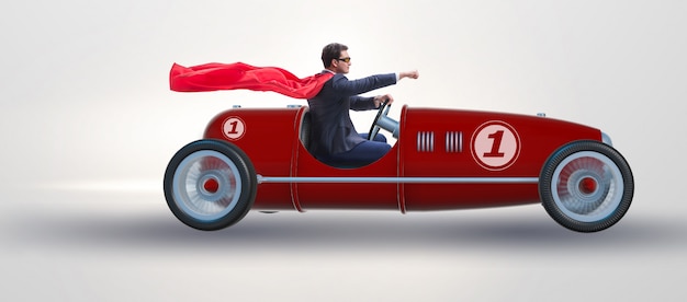 Superhero businessman driving vintage roadster