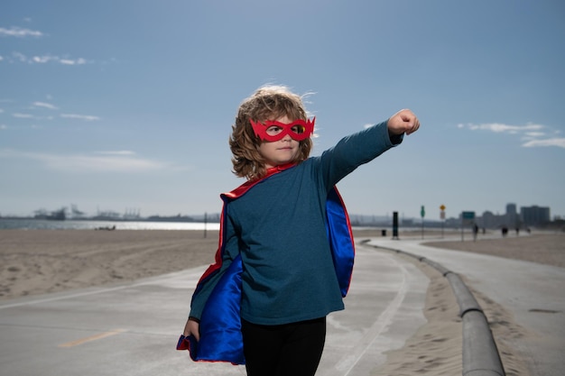Superhero child boy concept for childhood imagination and\
aspirations concept of boy power